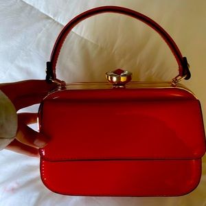 red mini purse, don’t remember the brand, still in shape, hasn’t been used.